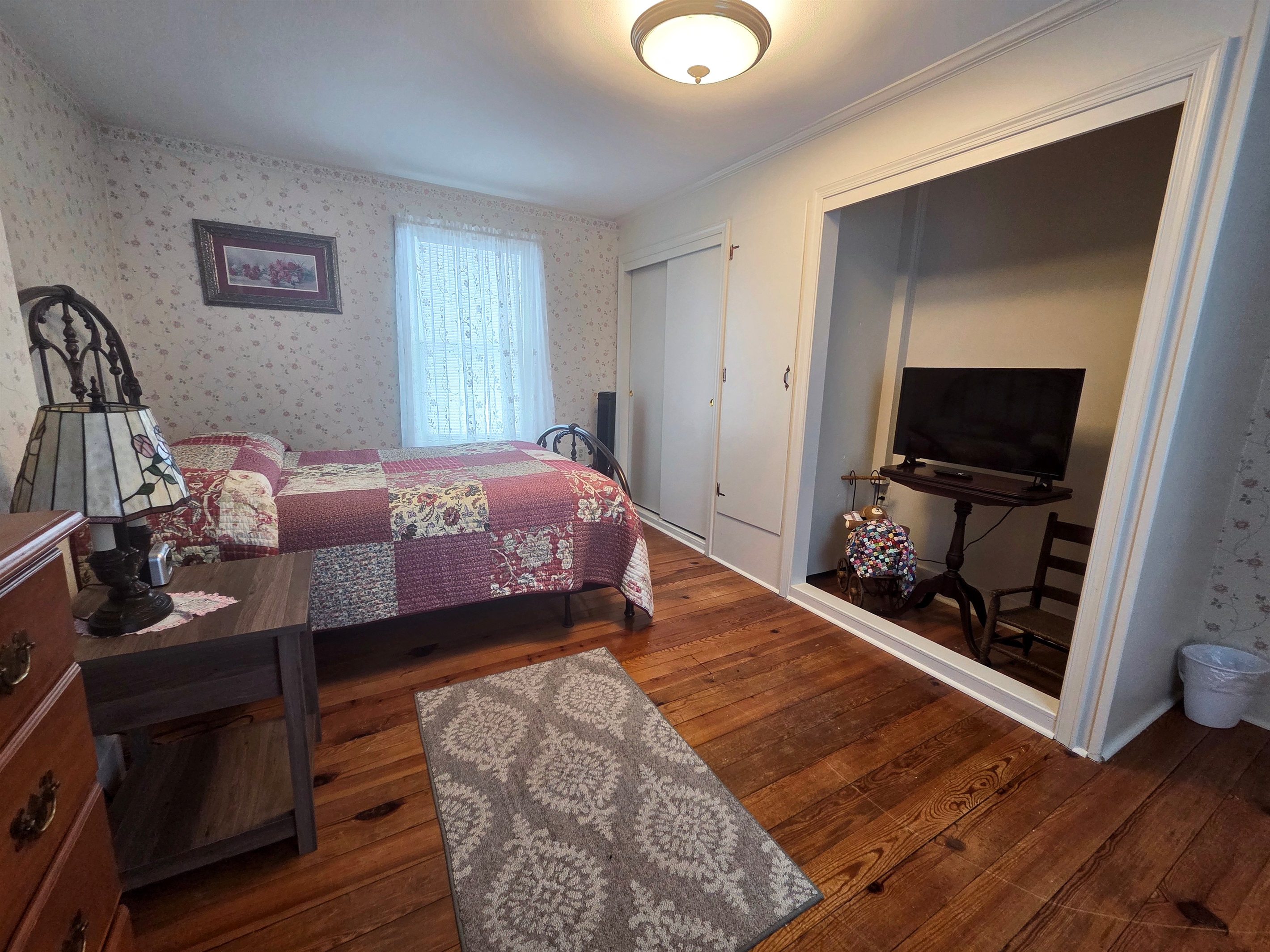 Third Upstairs bedroom featuring a comfortable full bed, with convenient access to the shared Jack-and-Jill bathroom.