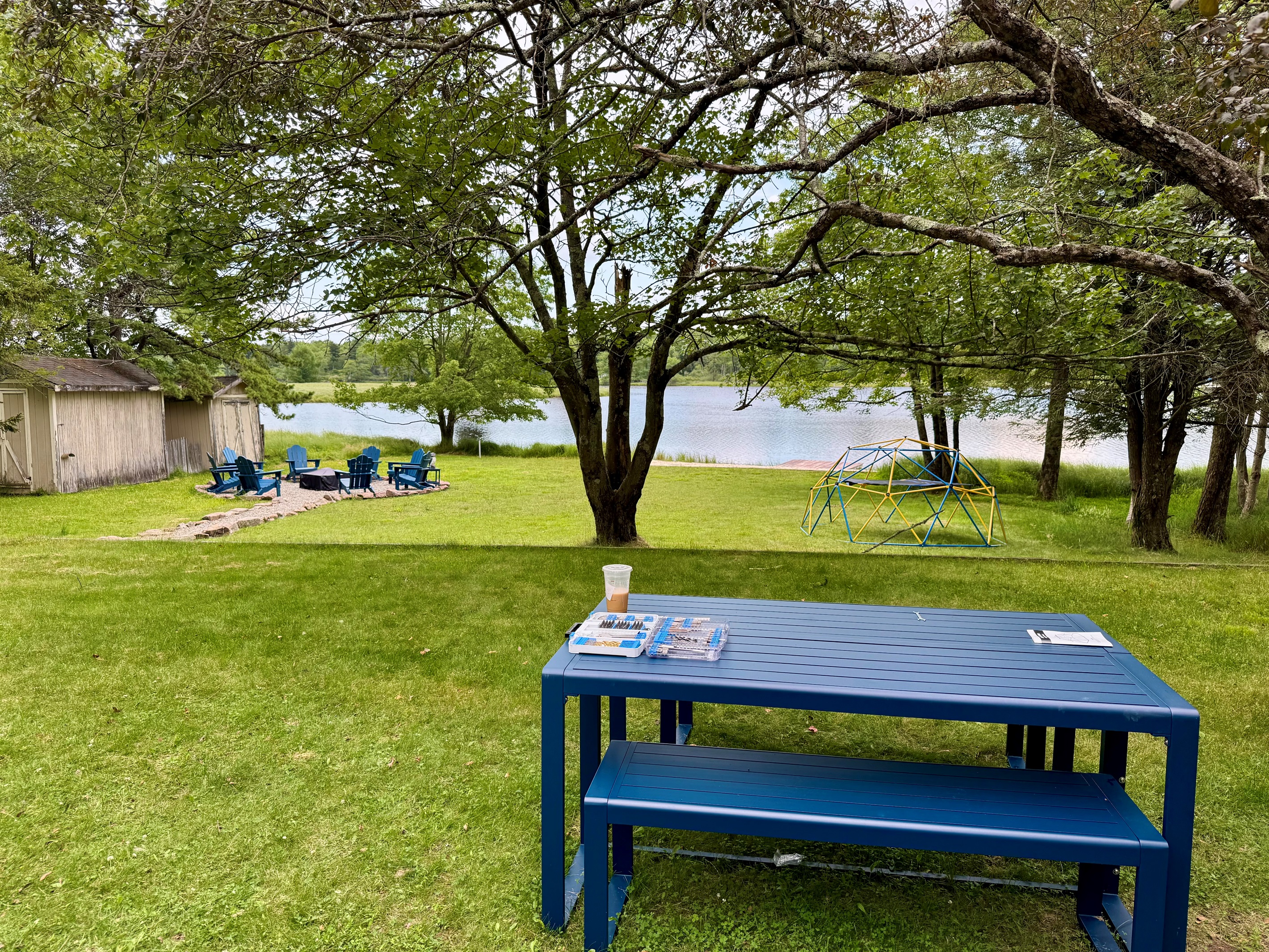 Blue-table picnics — lakeside meals and laughter.