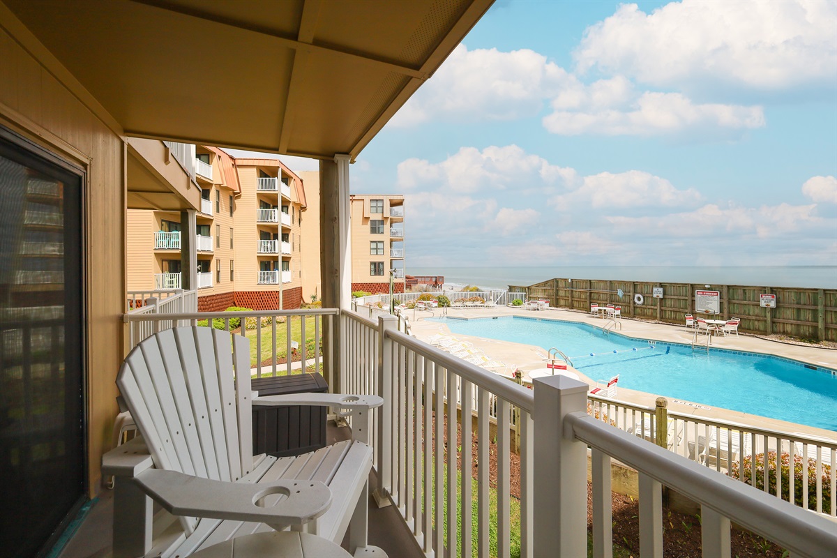 Adirondack chairs on the balcony make it perfect for relaxation