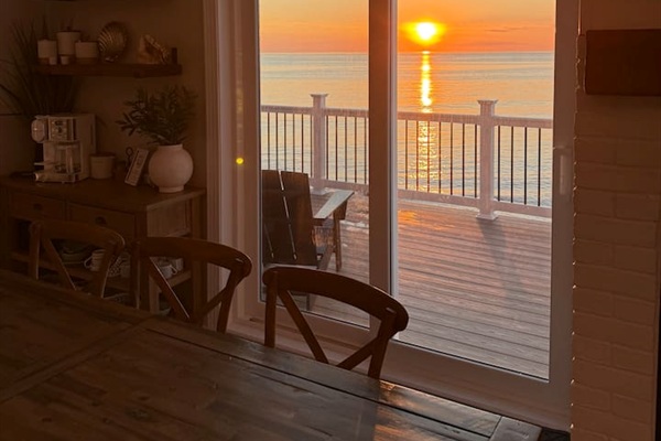 Unwind with a glass of wine and watch the stunning sunset paint the sky from this cozy dining area. It is the perfect, relaxing setting for friends and family to gather and enjoy a dream vacation by the ocean.