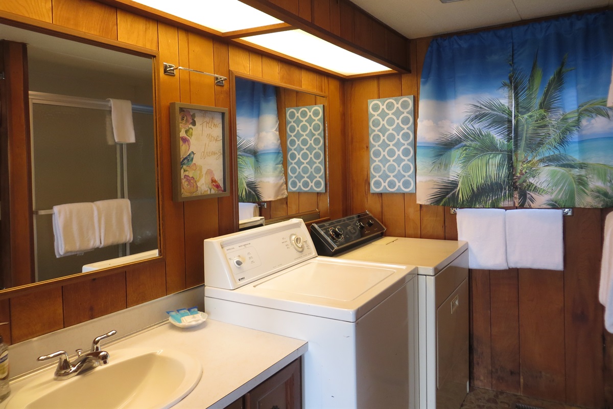 bathroom with shower/tub combo & Laundry
