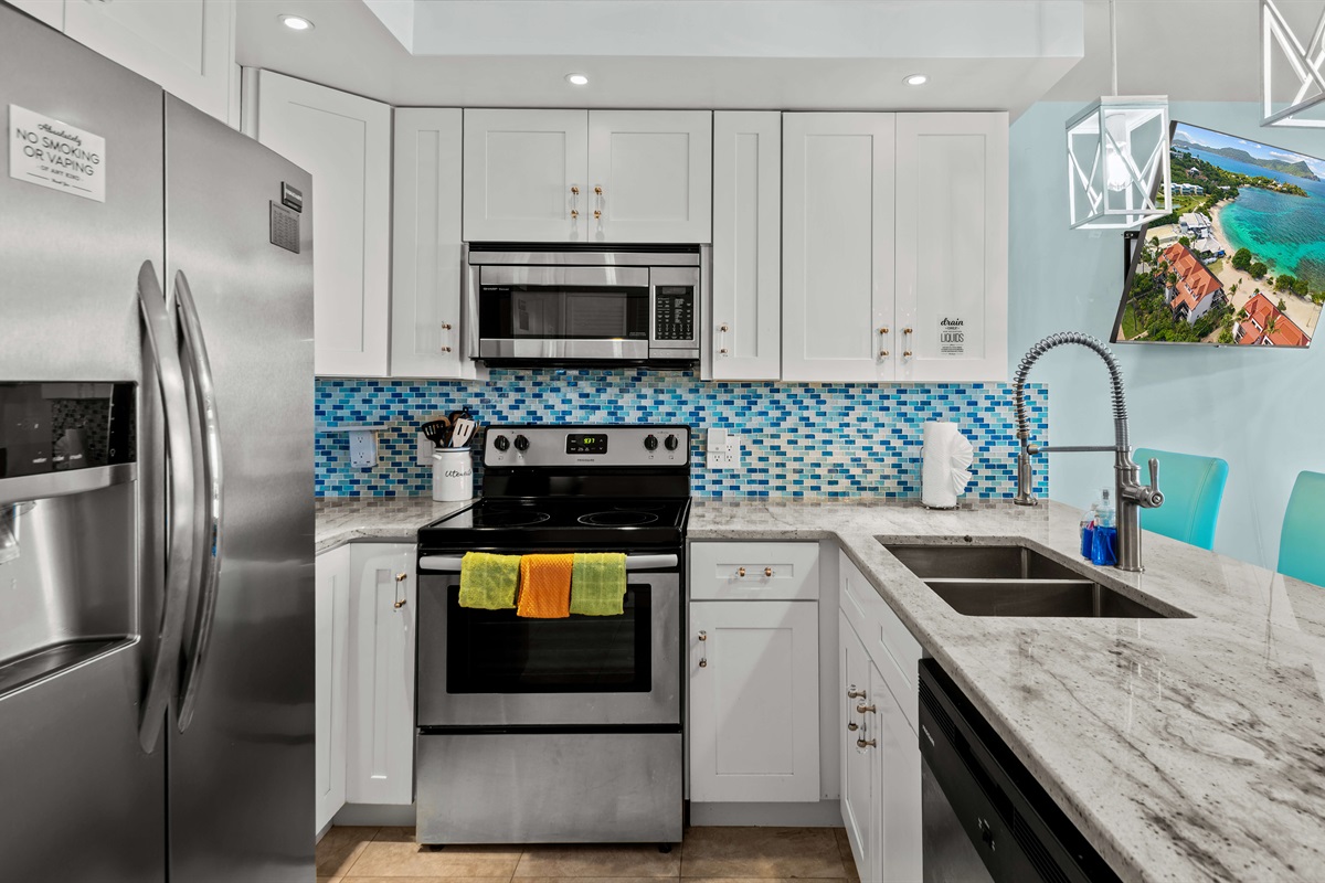 Full size refrigerator, cooktop, oven and dishwasher in this beautifully renovated kitchen
