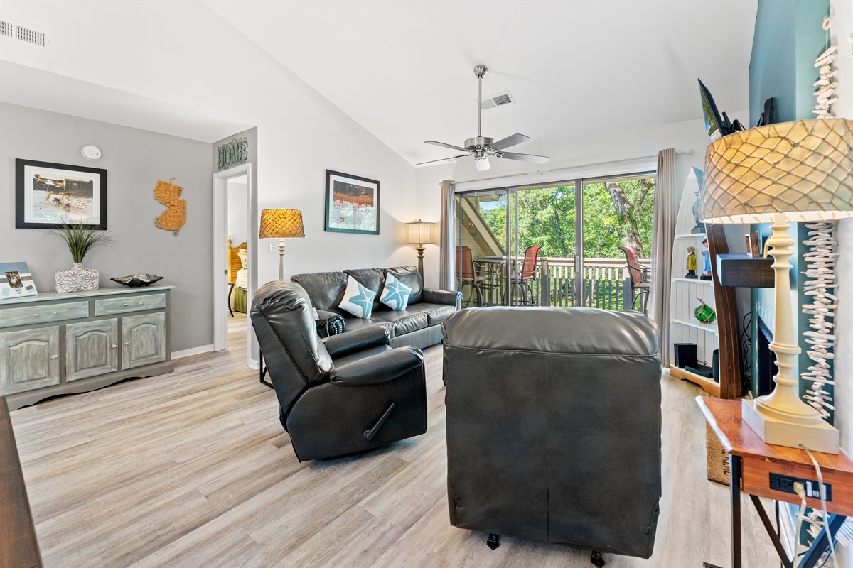 Large open Living room with large TV and patio access