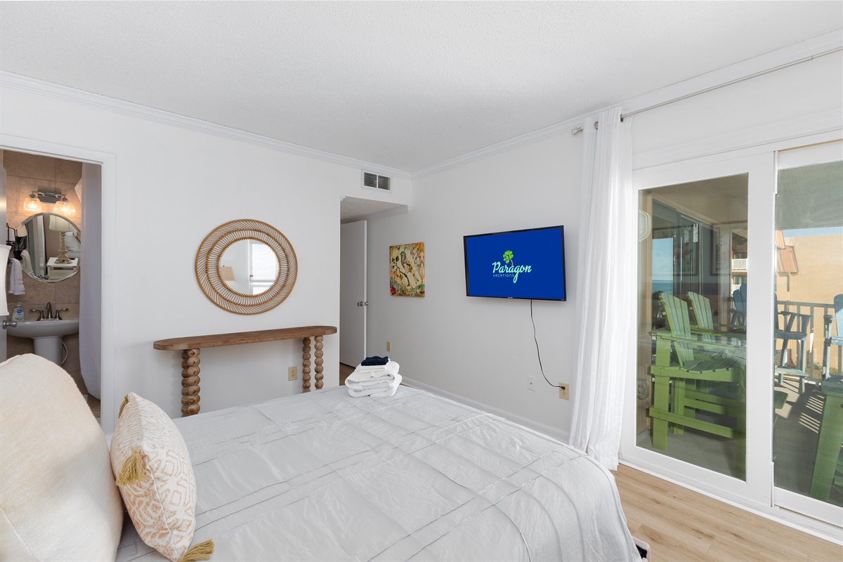 Master bedroom with balcony access & ensuite bath