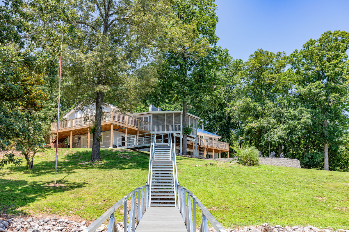 The private dock walkway leads directly toward the house and shows how close The View sits to the water.