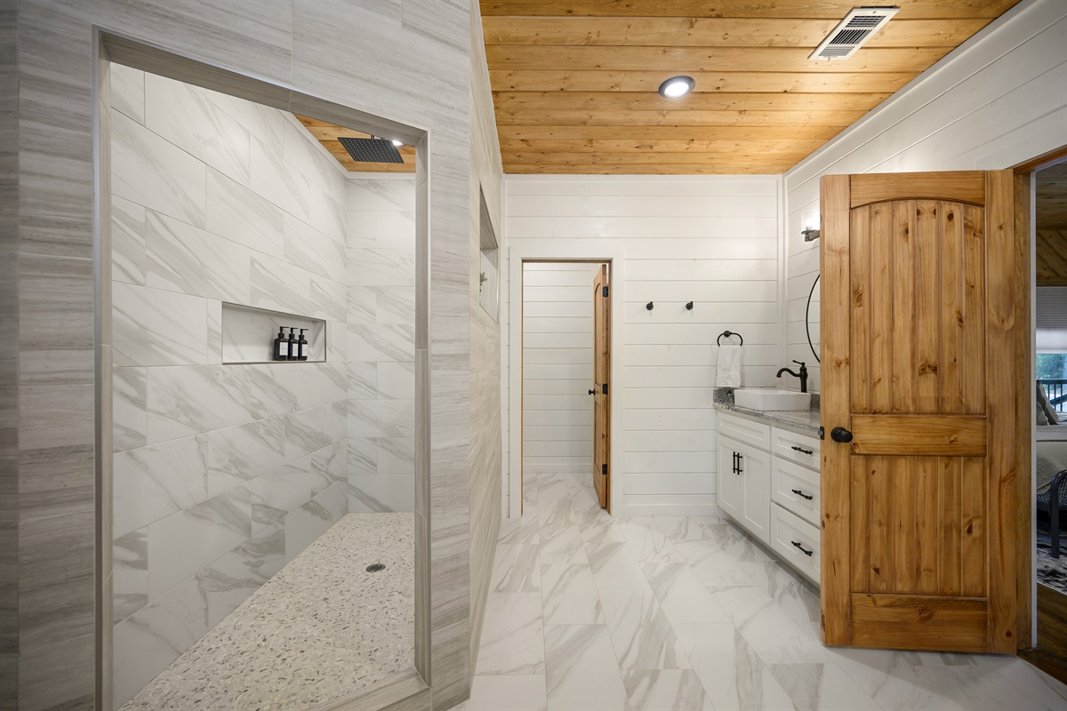 Luxury bathroom comfort with room to slow down and breathe deeper. 
From the walk in shower to the peaceful cabin atmosphere, this ensuite was made for unwinding after a day in the pines.