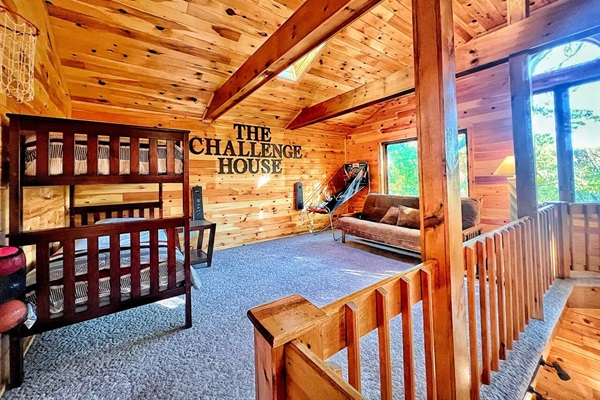 The 6th bedroom loft has twin bunk beds and a futon sofabed.