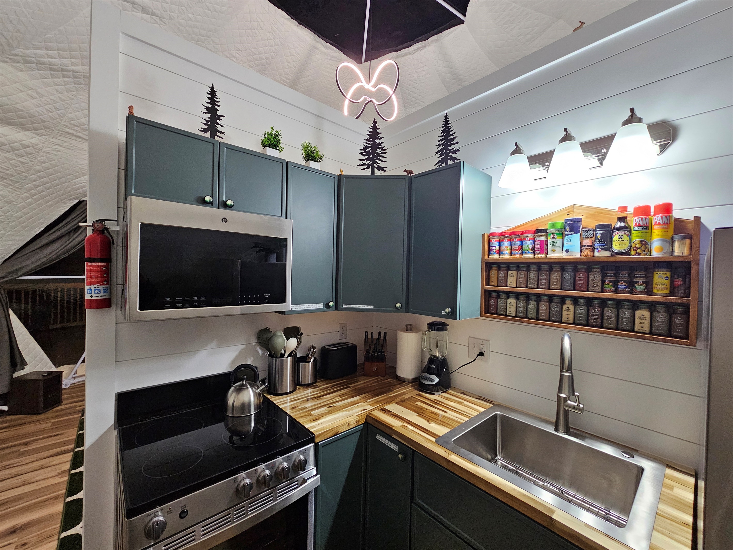 A thoughtfully stocked kitchenette for cozy meals in