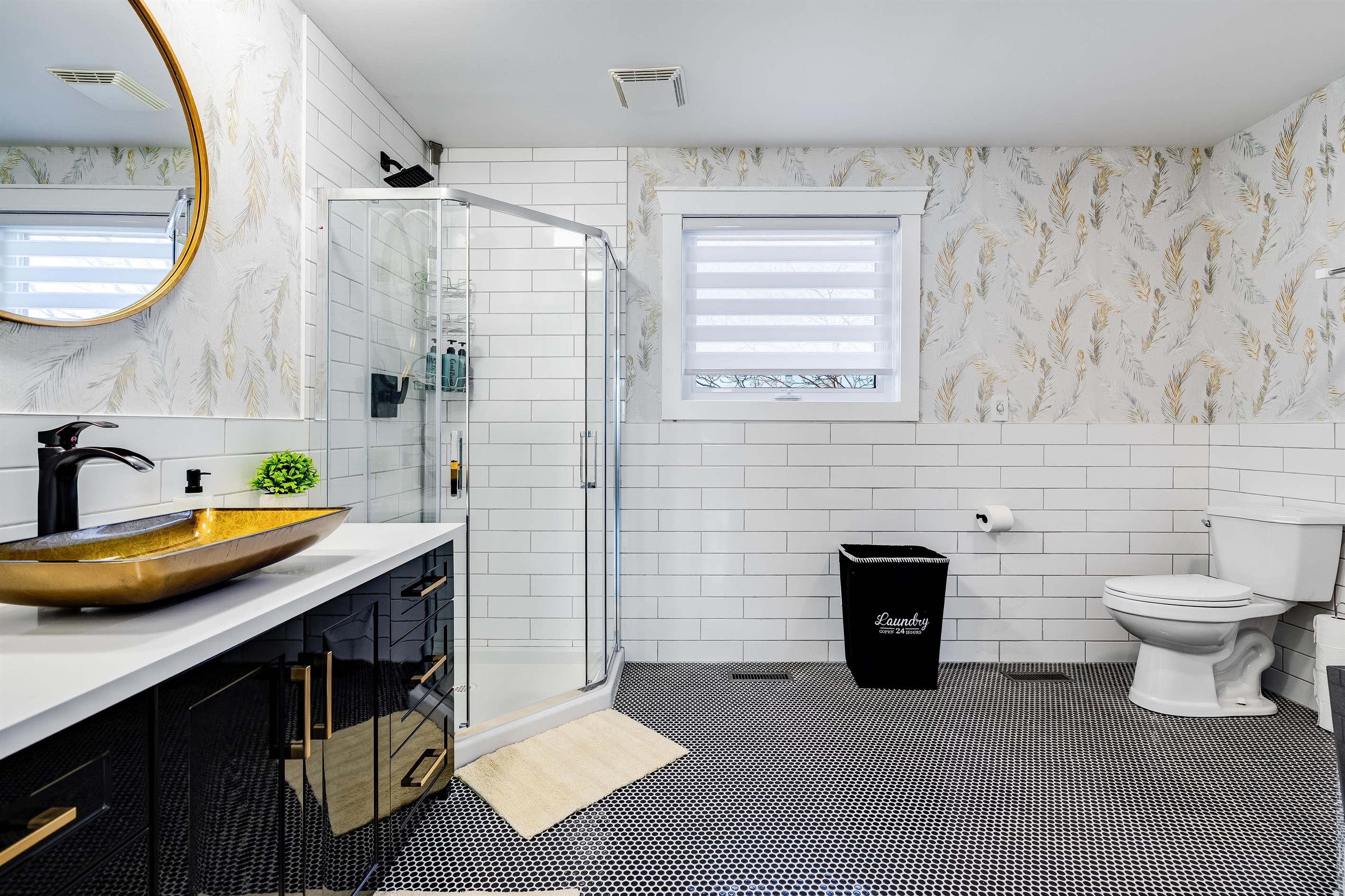 A Full bathroom with a serene spa experience in sculpted stone