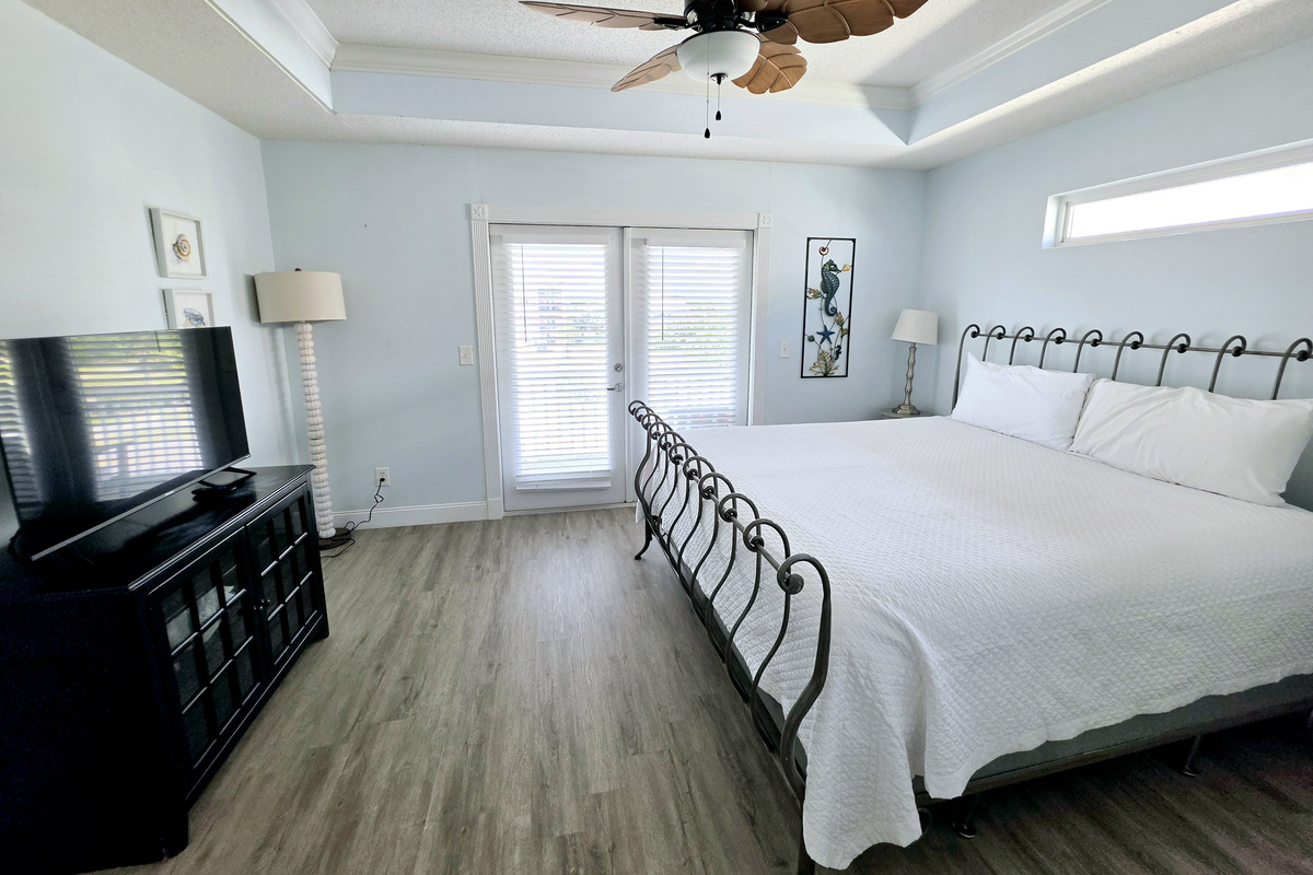 Primary bedroom with king bed and French doors