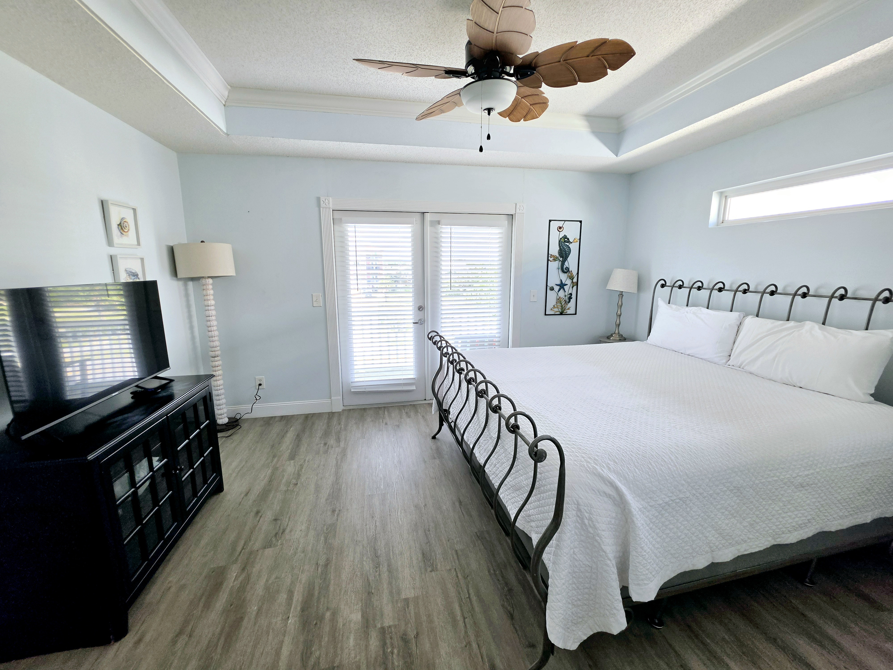 Primary bedroom with king bed and French doors