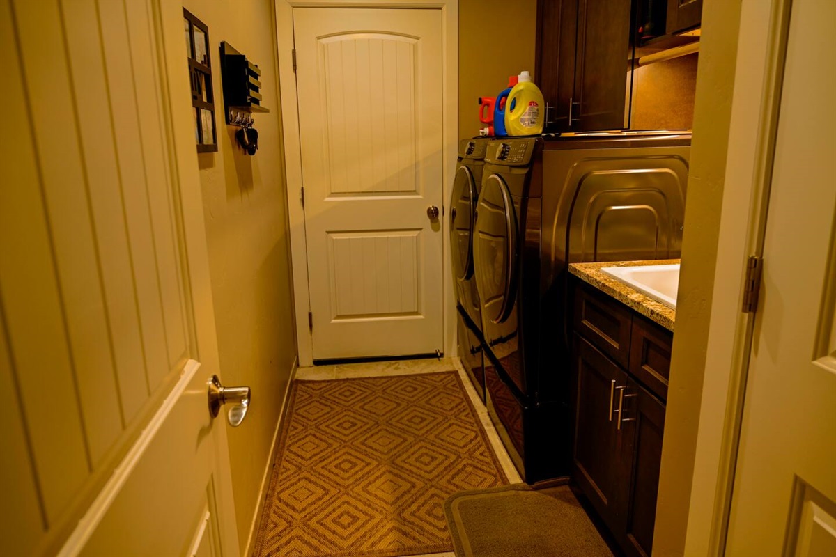 Utility room with washer and dryer.