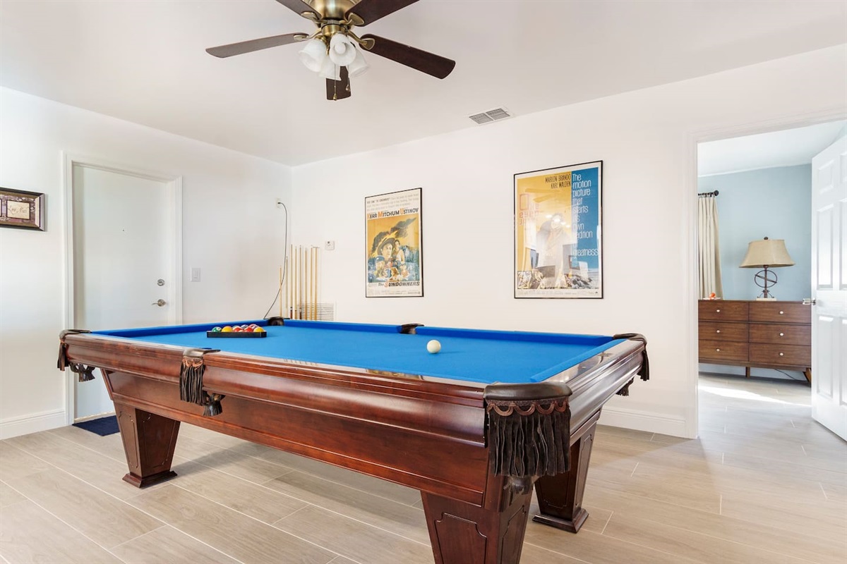 Game room with pool table. Chest full of board games. Bookcase with a small library ofliterature for adults, teens, and children. Purely Pompano has something fun for everyone!