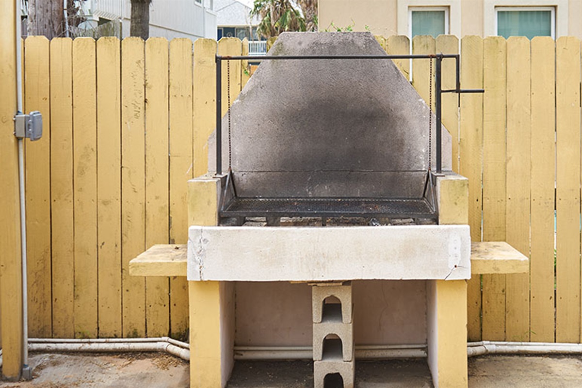 Open flame charcoal grill in the patio