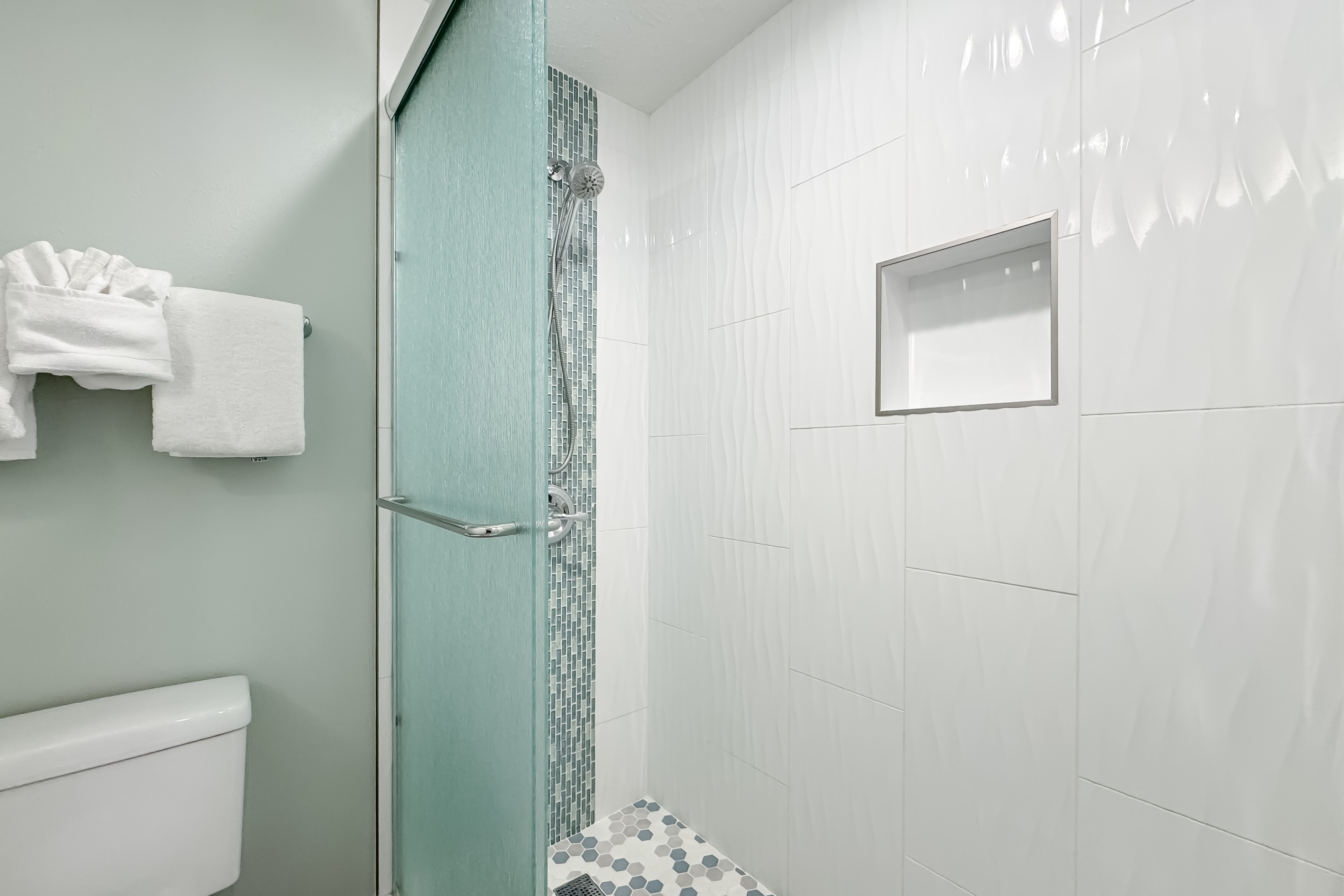 Indulge in the seamless flow between the luxurious guest bathroom and bedroom.