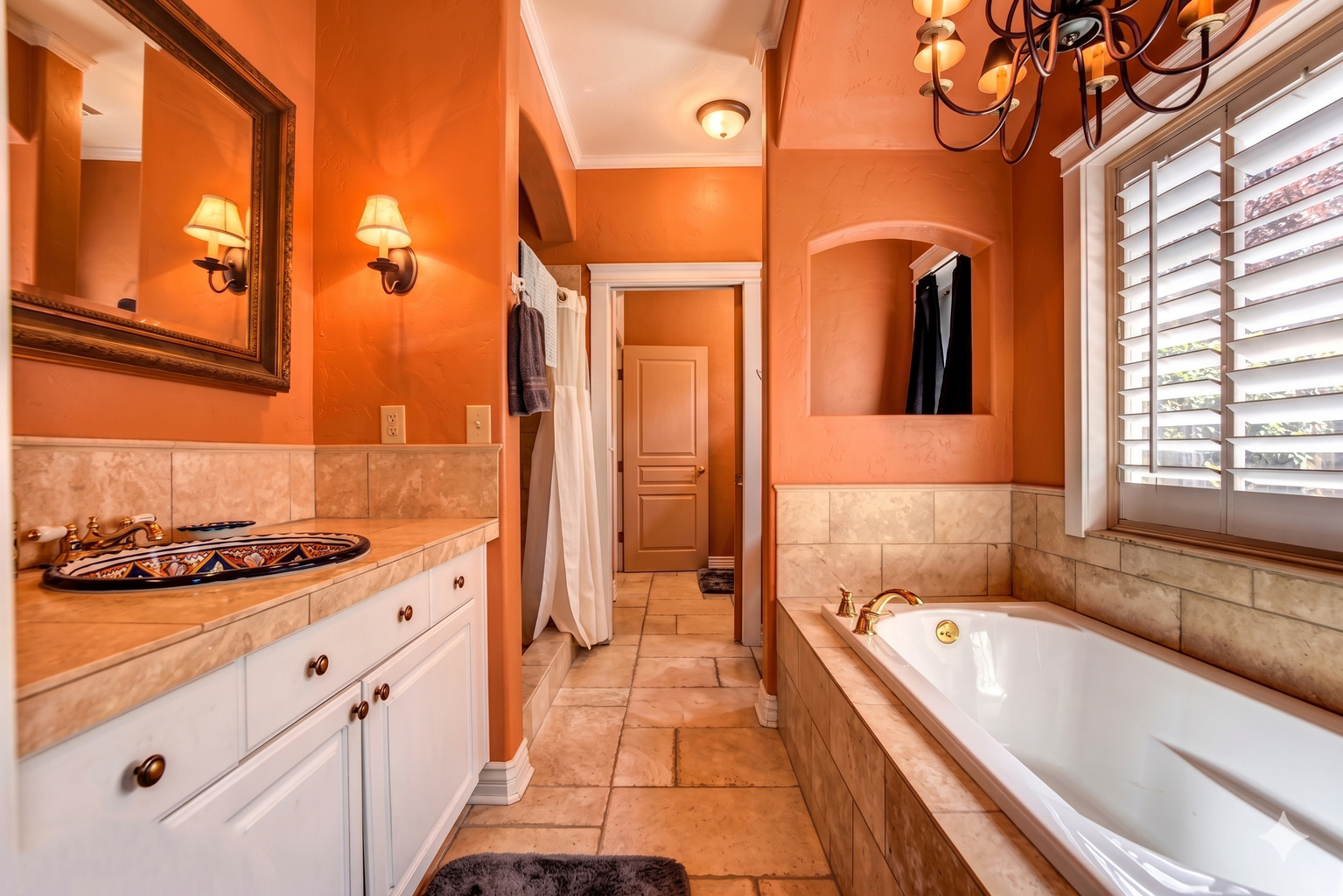 Refresh in the sparkling clean, modern bathroom, featuring a walk-in shower and large bathtub.