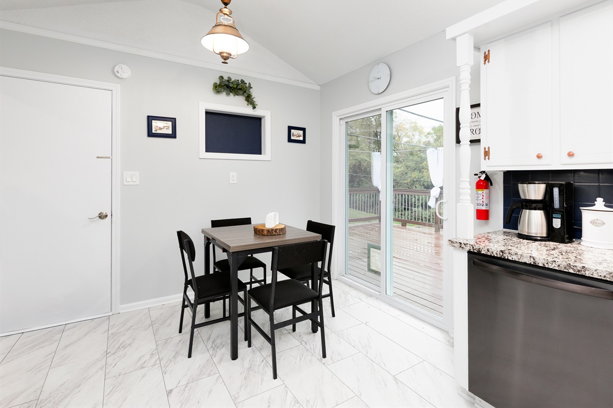 Bright eat-in dining area with a versatile table that extends to seat six comfortably—perfect for shared meals and connection.