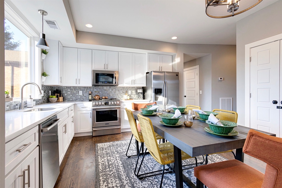 - Bright, modern kitchen with stainless steel appliances and loads of counter space - Bold chairs and a playful dining setup make every meal feel like a celebration - Whether you're cooking up brunch or just hanging out, this space brings people together