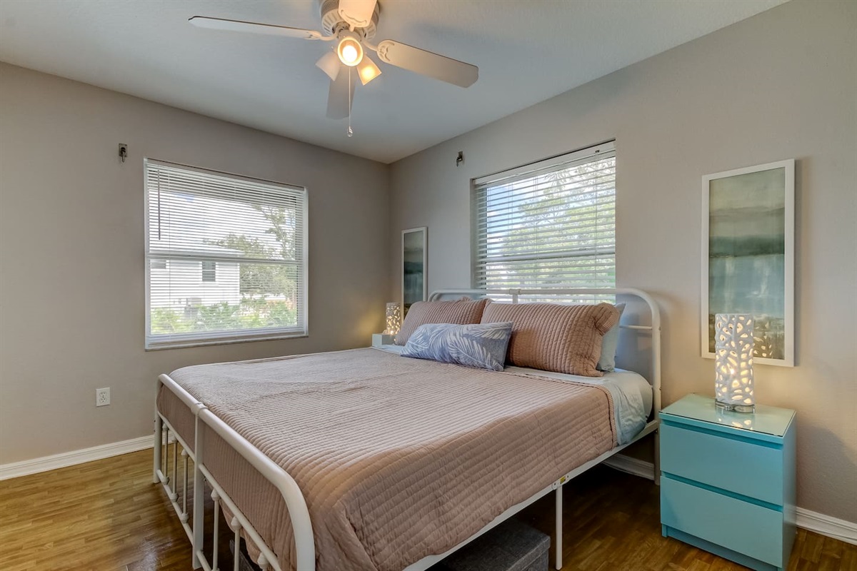 King bed with closet and half-bathroom