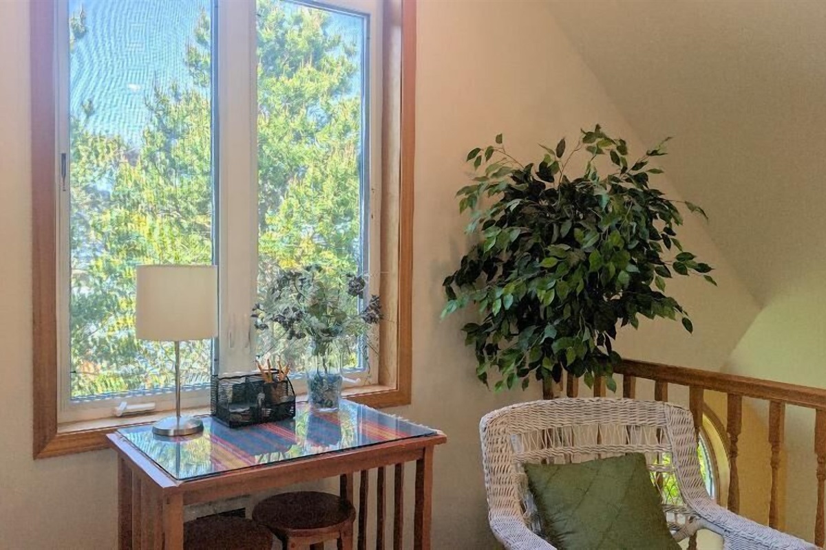 bar height table with 2 stools in loft