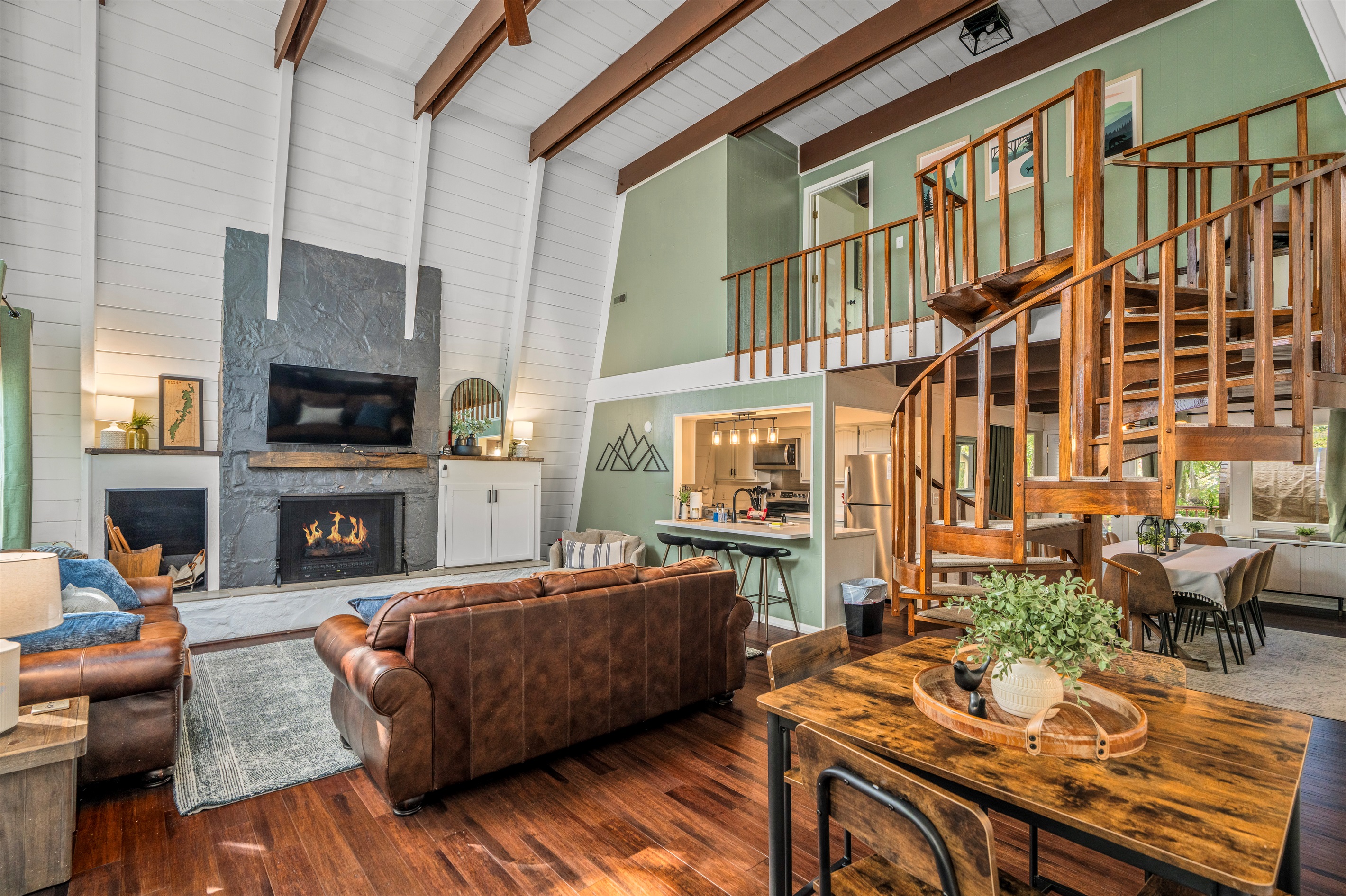 Two-story windows and the spiral staircase give a modern treehouse feel