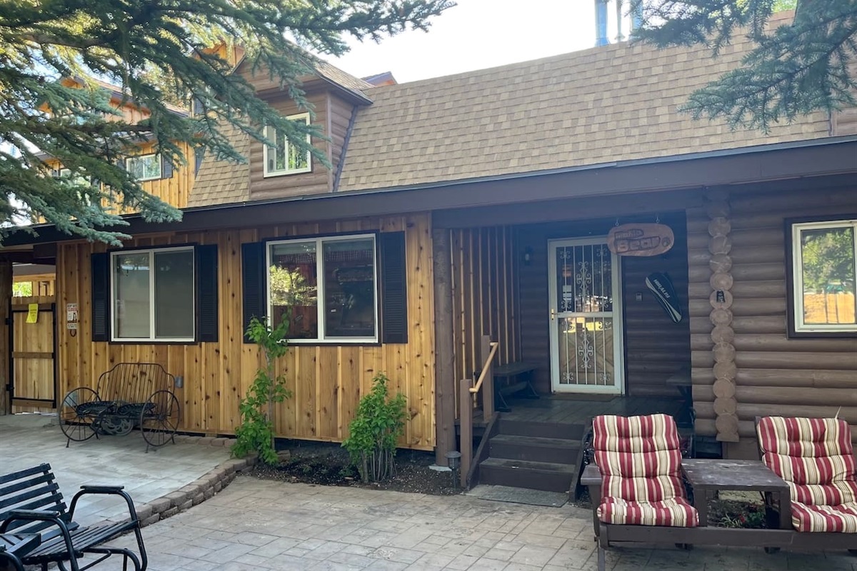 Front porch area with patios and lawn furniture are just waiting for you to enjoy.