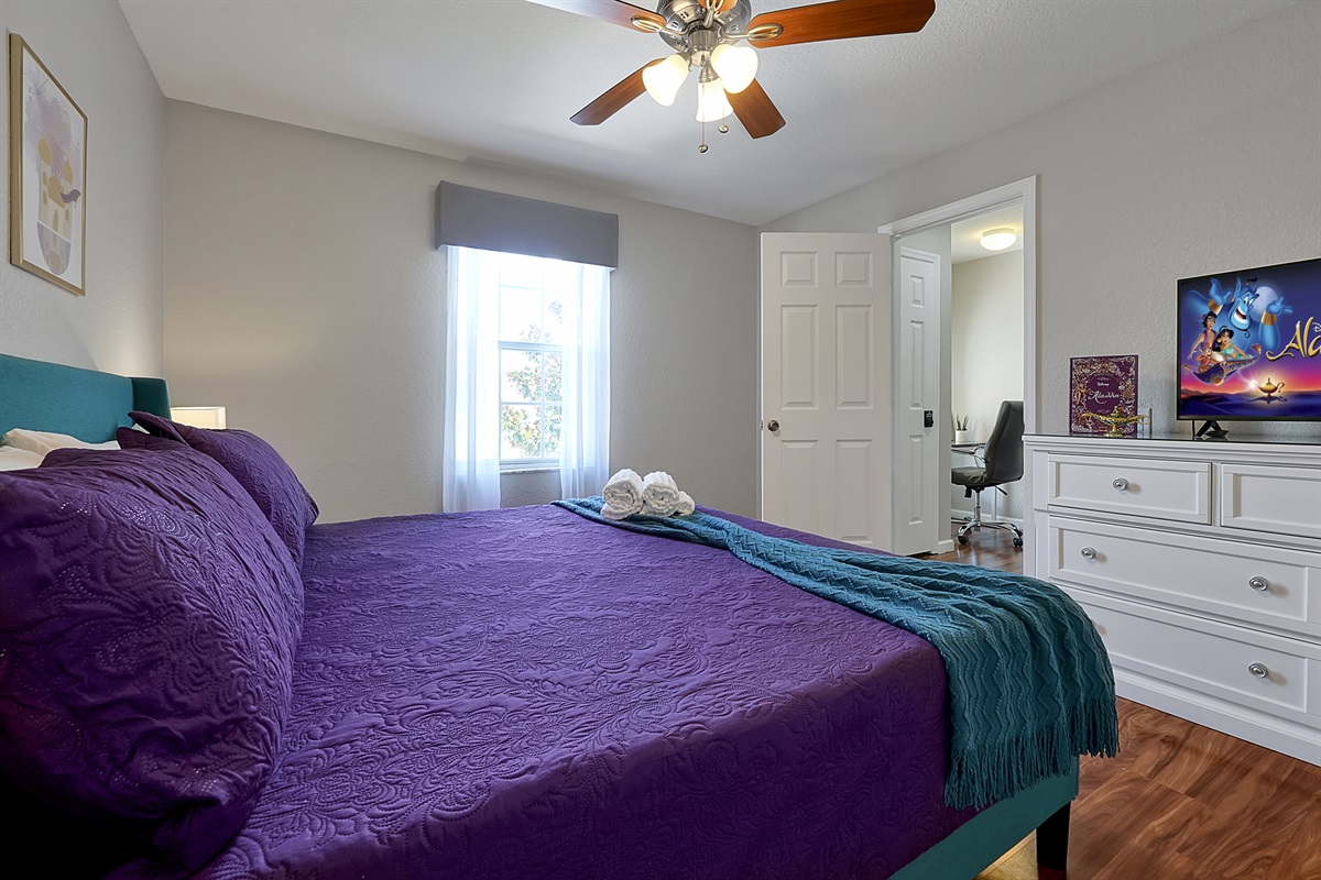 It's a whole new world in the Aladdin themed King suite. This room features a bold, beautiful bedframe and bright bedding, a brand new mattress, soft 100% cotton sheets, and a 40&rdquo; Roku TV.