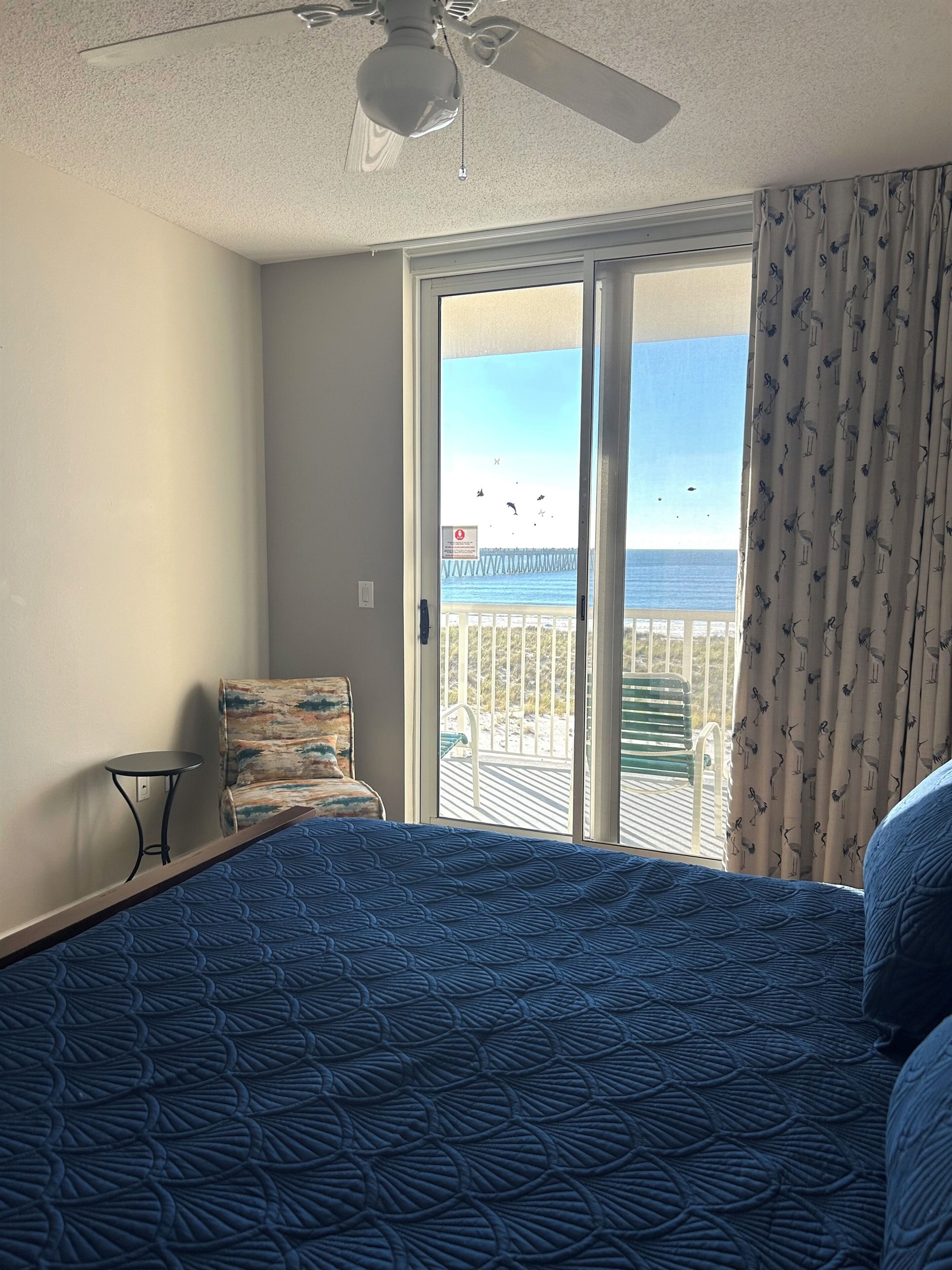 King master bedroom overlooks the beach with access to the balcony.