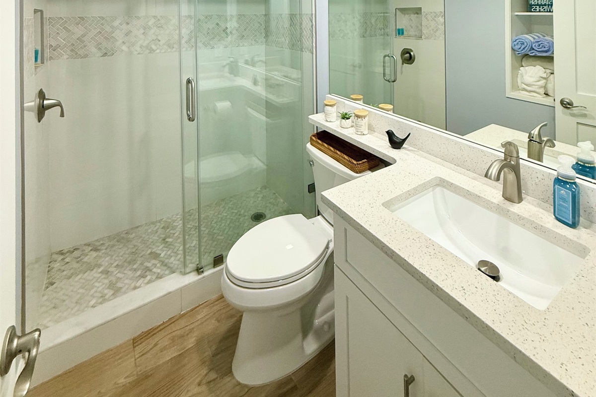 Bathroom renovated for clean coastal vibe & maximal function of space
