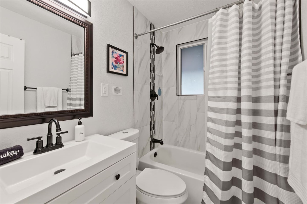 Full bathroom with shower and tub