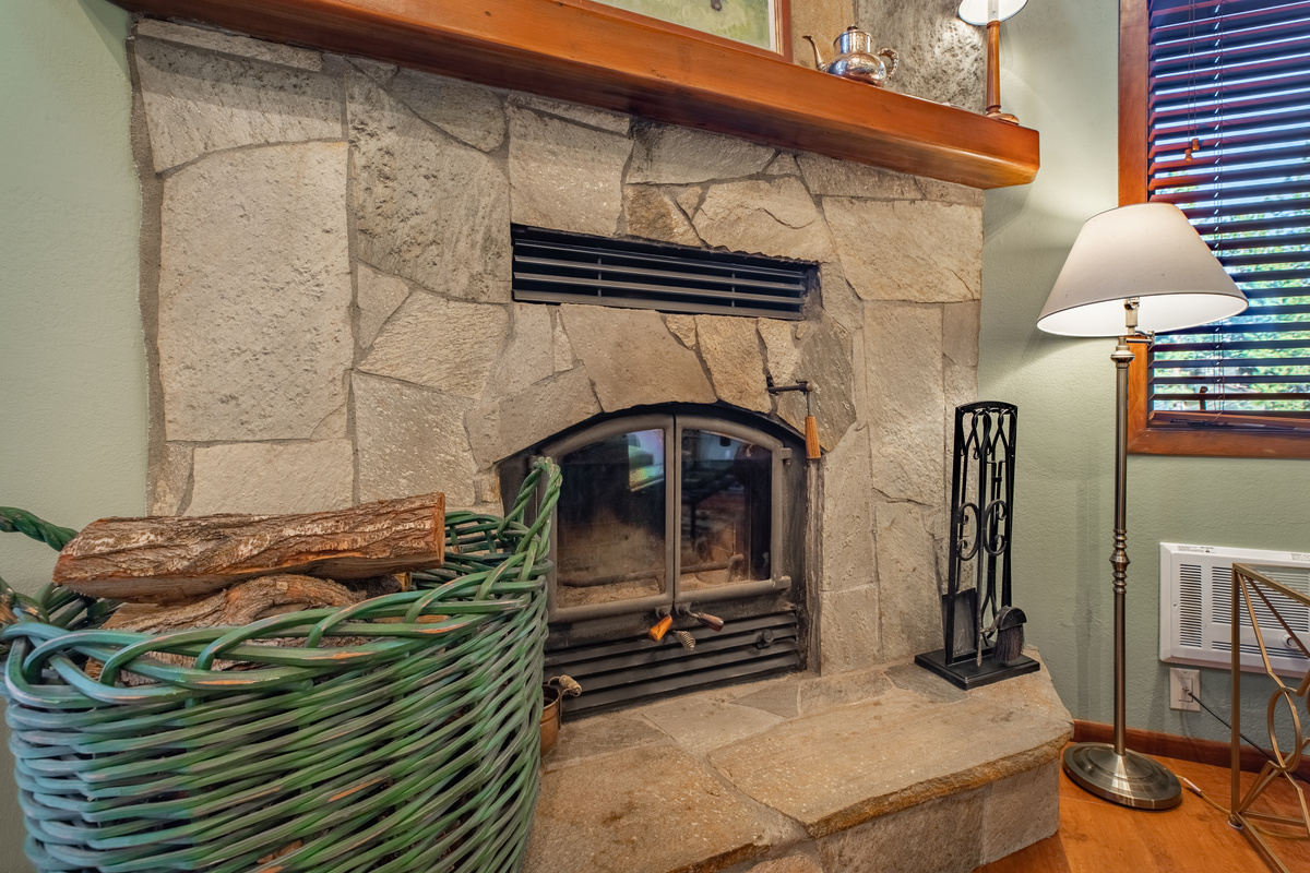 Rustic stone fireplace for cozy evenings.