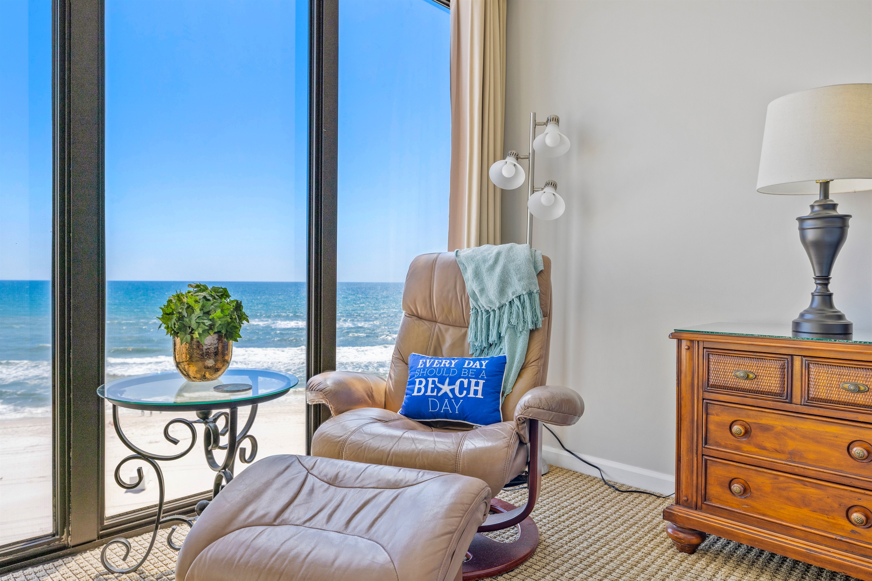 Floor to ceiling windows for immense view of the beach when relaxing in a leather chair in air conditioning!