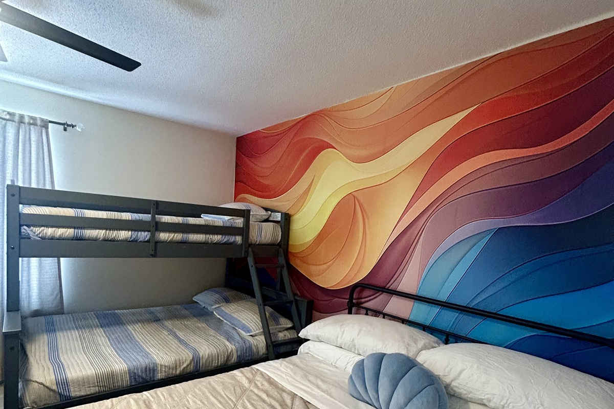Second bedroom with a King bed and a twin over full bunkbed on second floor