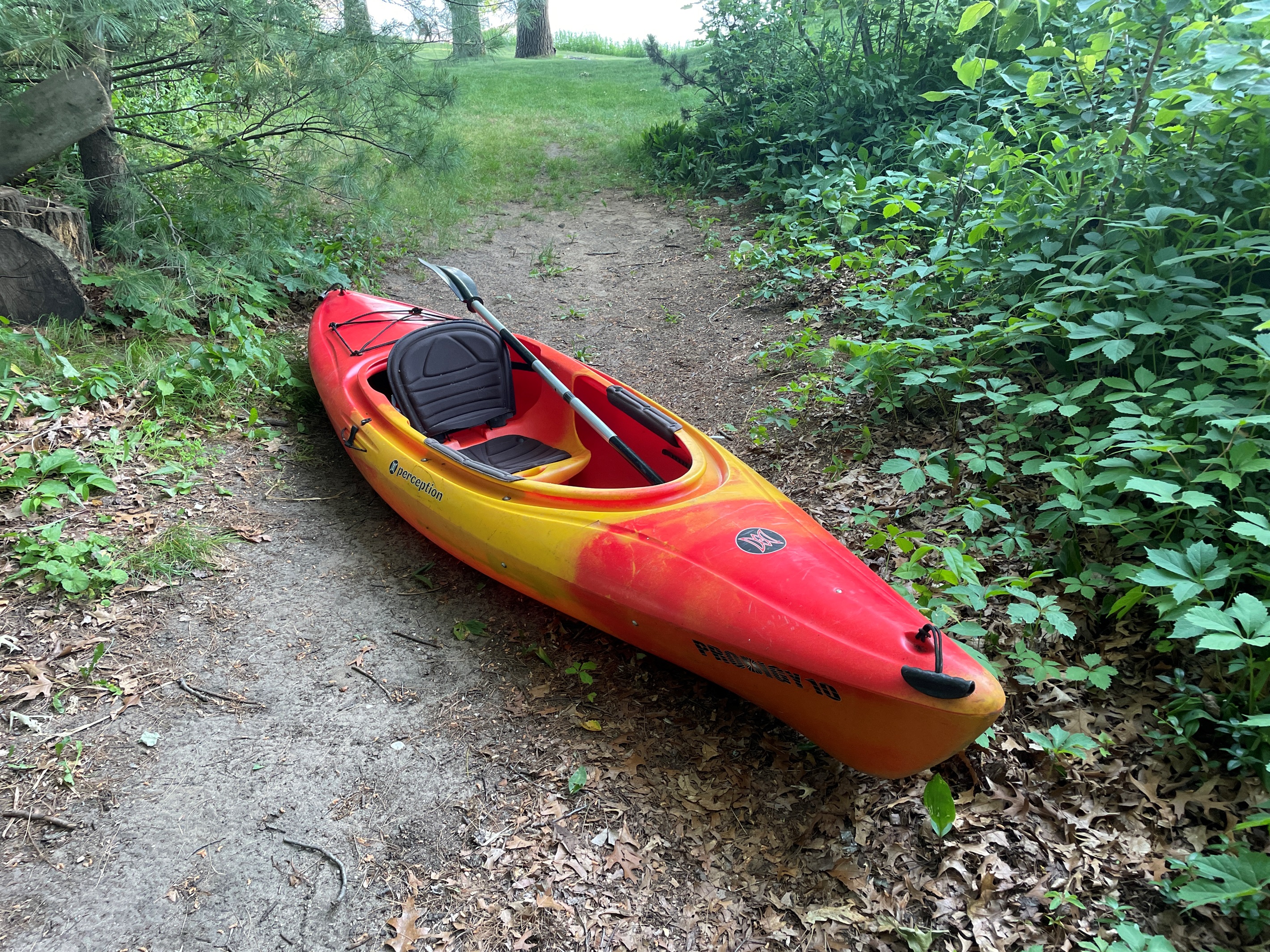 Kayak on pathway to waterfront