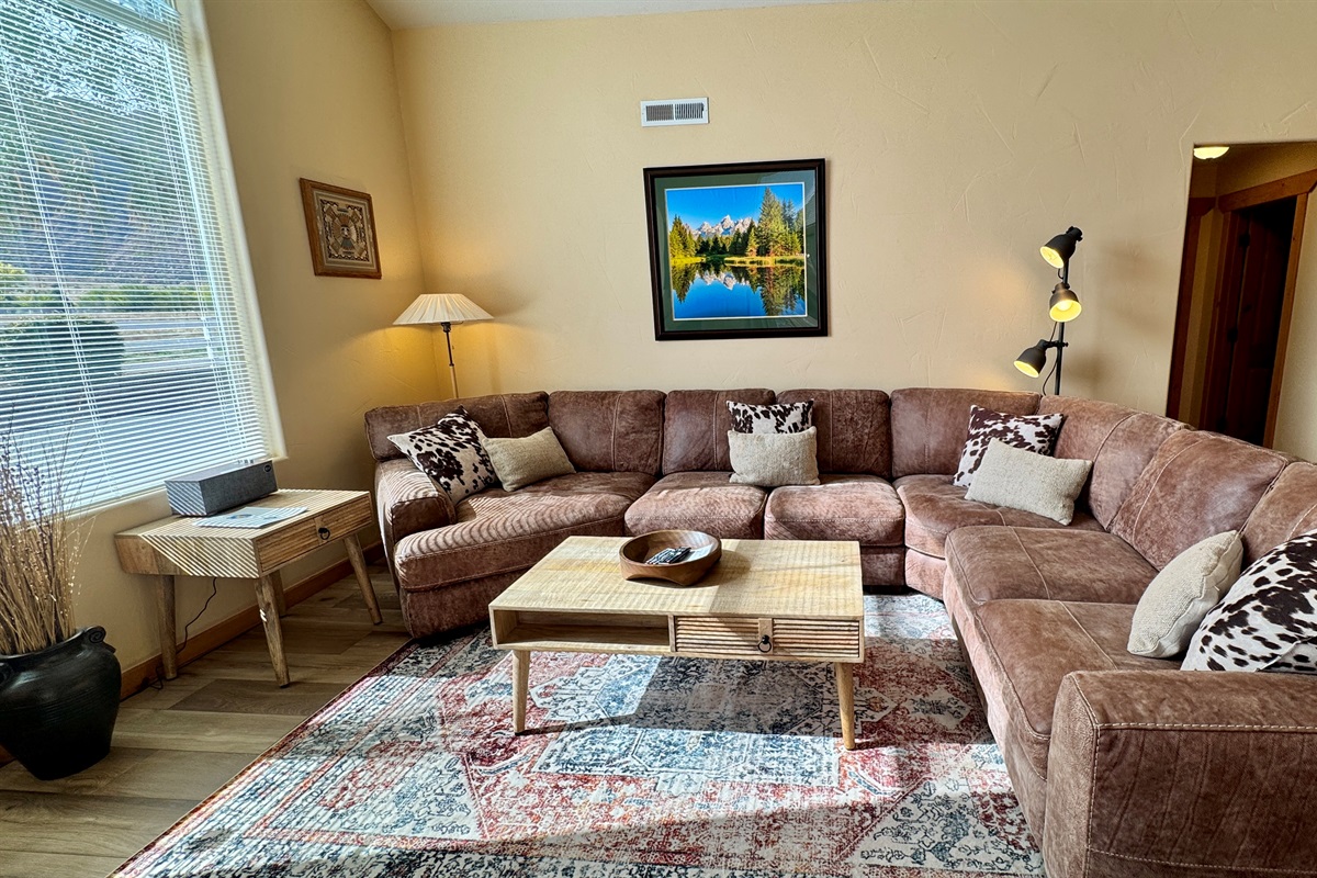 Spacious living area with large leather sectional and huge views!