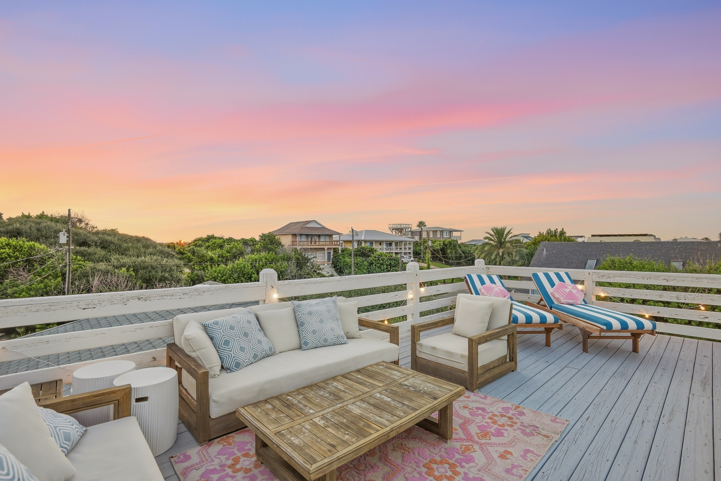This photo gives you a great sense of the outdoor deck and backyard space. While cozy, it’s thoughtfully layered to create intimate spots for dining, chatting, or relaxing. Even with a large crowd, everyone can find their own little nook to enjoy!