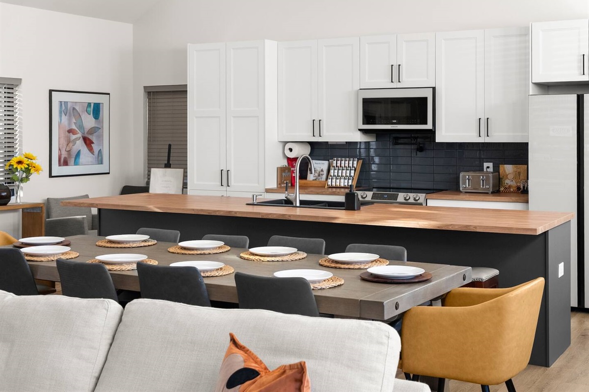Fully equipped large kitchen with everything you need, featuring beautiful wood countertops—ideal for cooking and entertaining