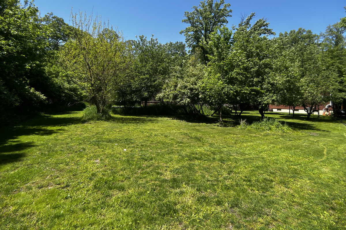 The gazebo and pickleball court are behind the grassy berm.