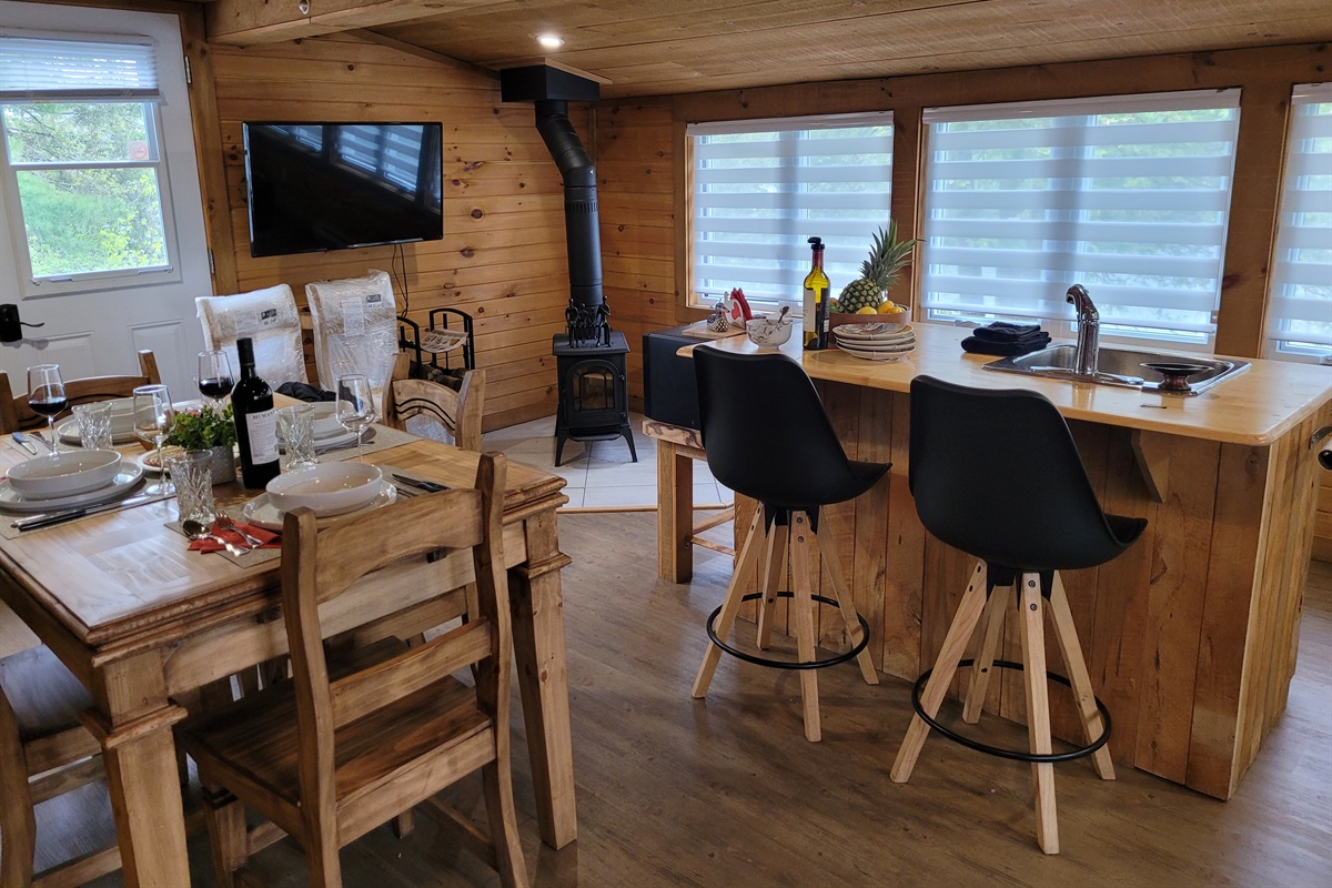 Wood stove and TV; firewood is supplied for you to relax and stay warm when the temps drop