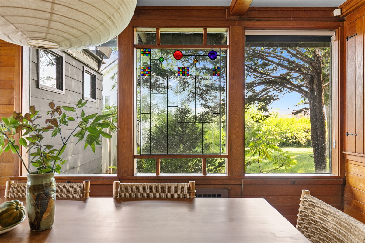 The home’s modern architecture is beautifully accented by stained glass windows, adding warmth and character to its sleek design.