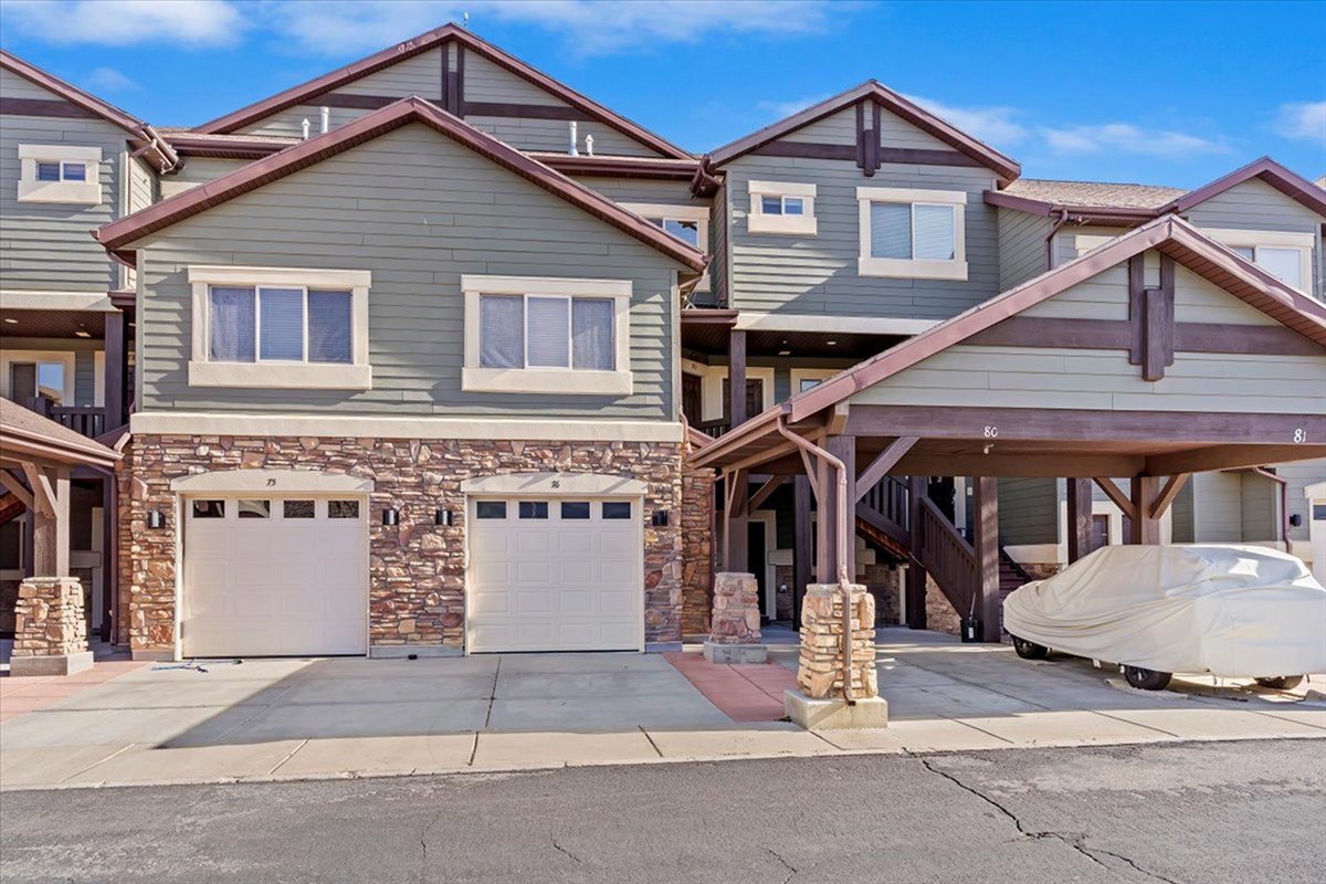 A charming exterior showcasing classic mountain architecture, complete with stone accents and a welcoming covered entry.