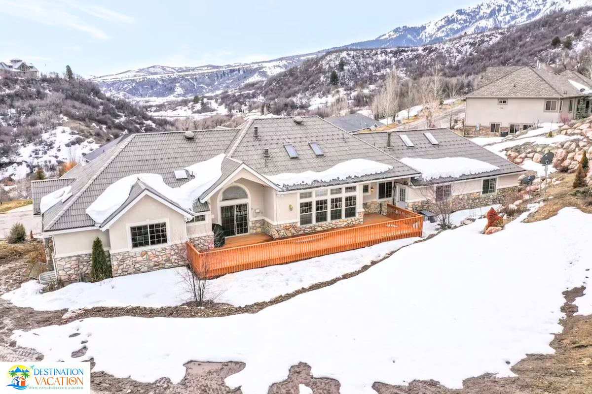 Stunning mountain home surrounded by peaceful winter scenery.