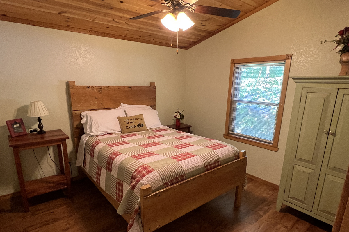 Entry level bedroom has queen bed with luxurious linens.