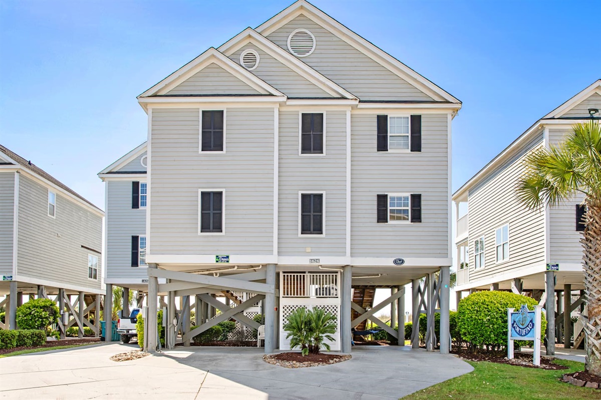 Ample parking under the house on right and left.  Two cars fit in each side.  Four car maximum.  