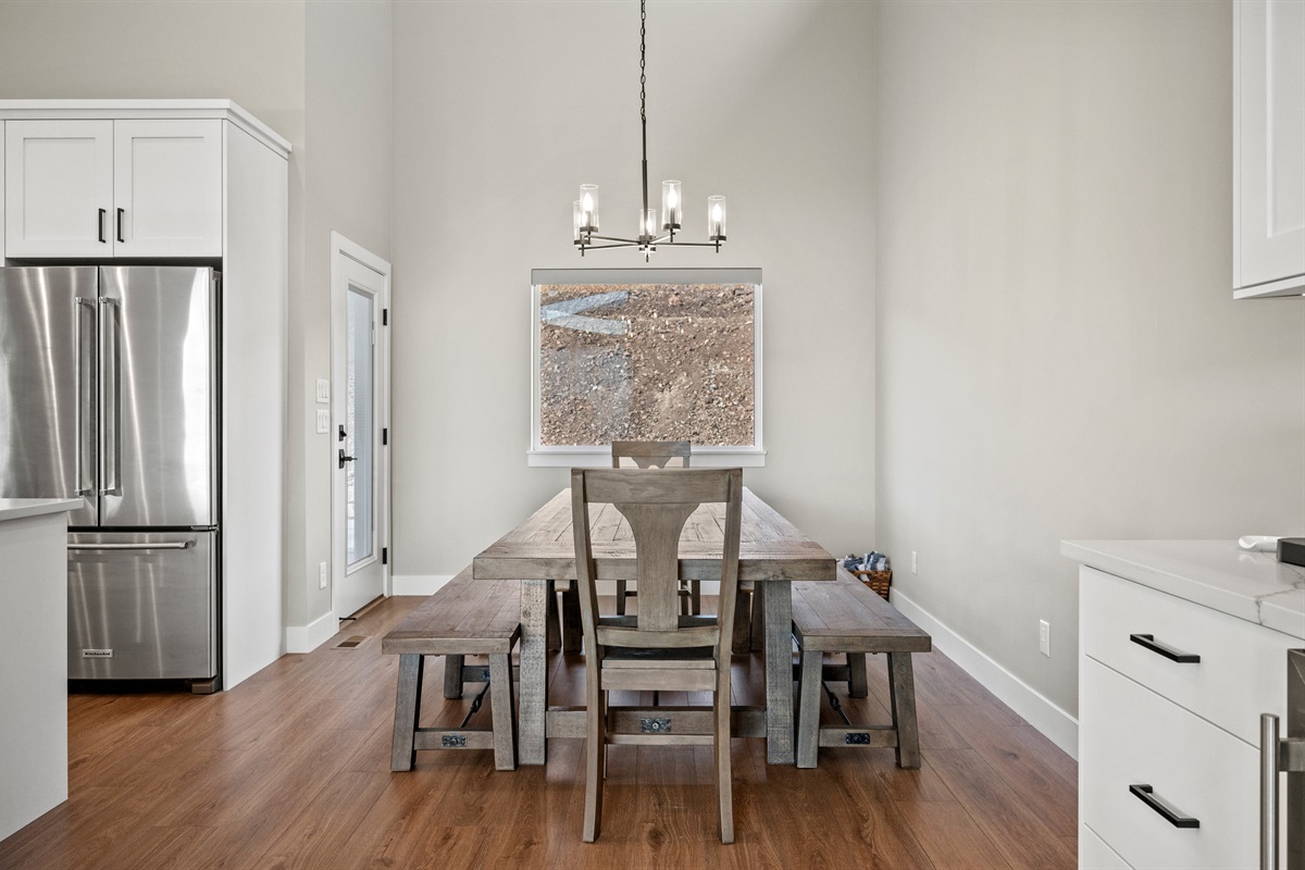 Rustic wood table with bench and chair seating for eight—perfect for family dinners.