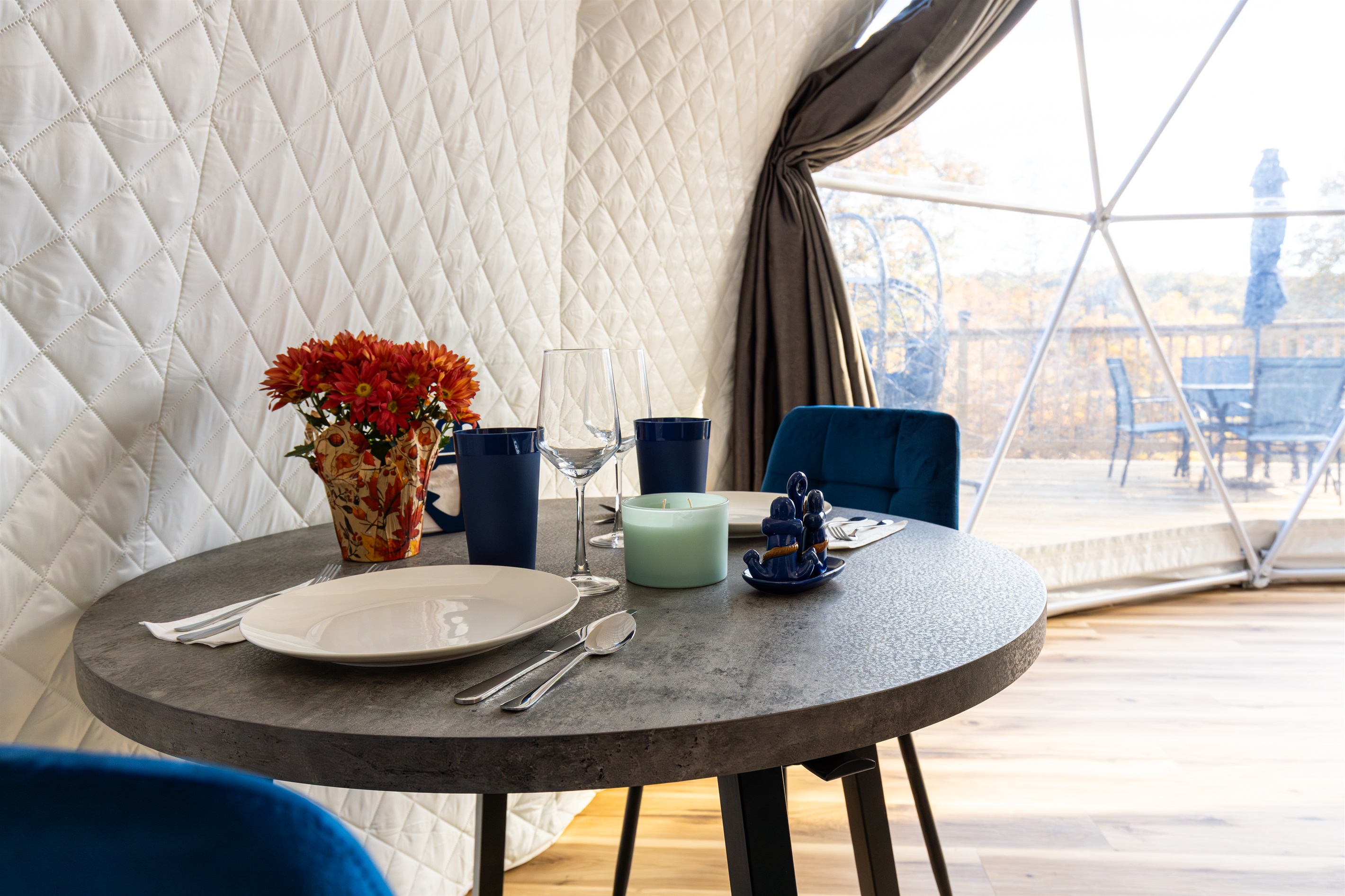 Cozy dining nook for two with lake views—perfect for slow breakfasts, romantic dinners, and morning coffee in your private dome.