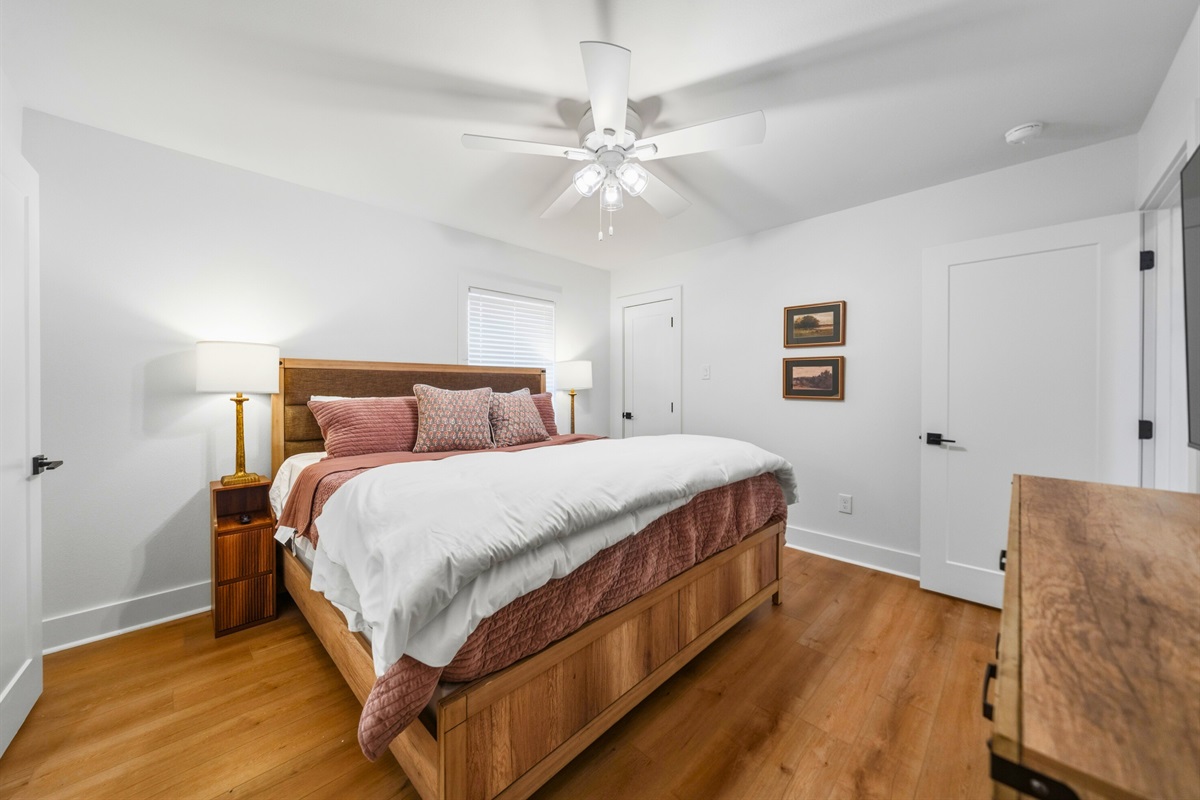Another view of this king bedroom offers a bright and relaxing retreat with clean, modern decor and plenty of room to unwind.