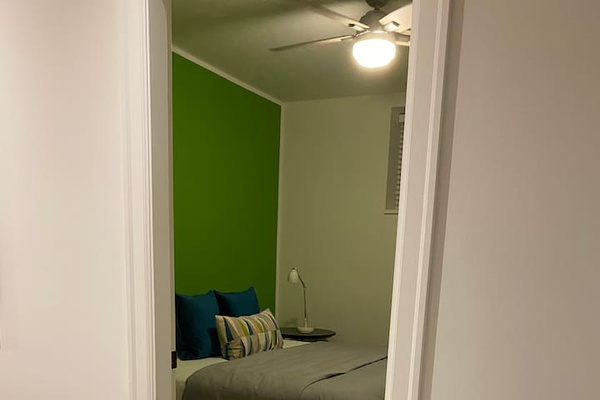 The entry way into the second bedroom with a king size bed.
