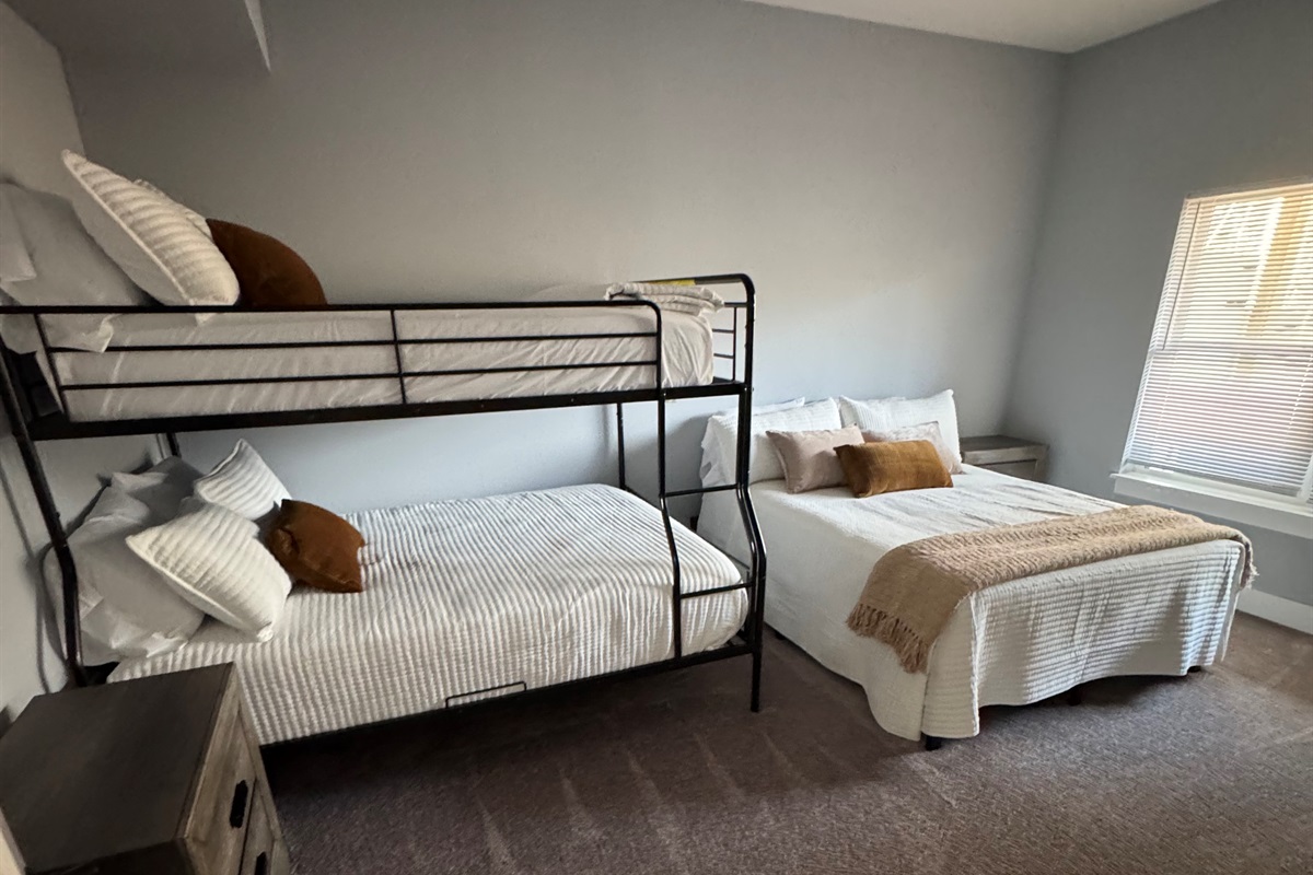 Lower level 
Full over Queen Bunk and Queen bed. Shares bath with King bedroom on that level