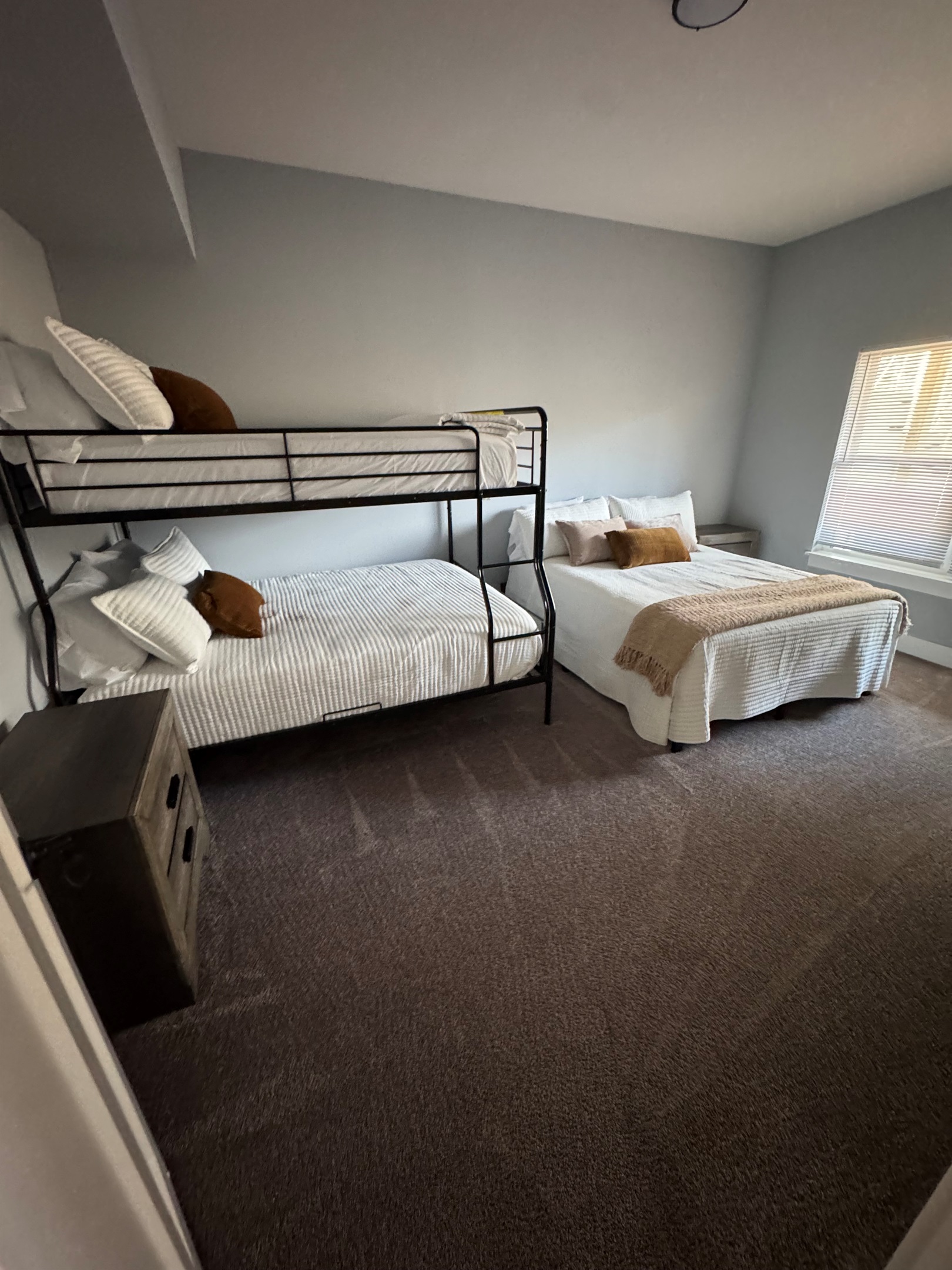 Lower level 
Full over Queen Bunk and Queen bed. Shares bath with King bedroom on that level